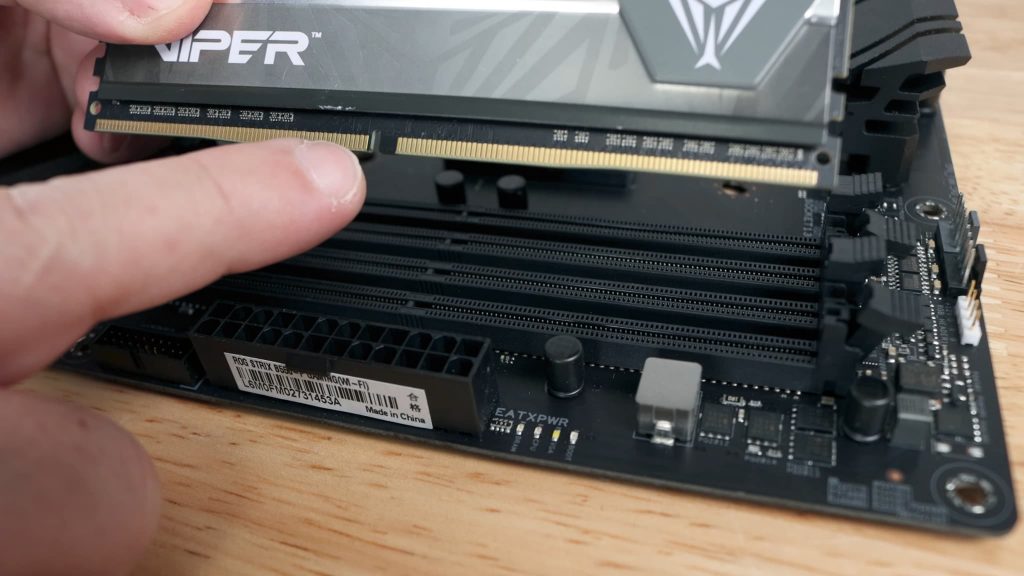 Remove the RAM modules from their packaging and carefully align