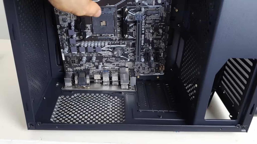 Slowly lower the motherboard onto the standoffs