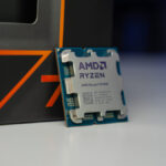 An AMD Ryzen 7 9700X CPU sat in front of its box