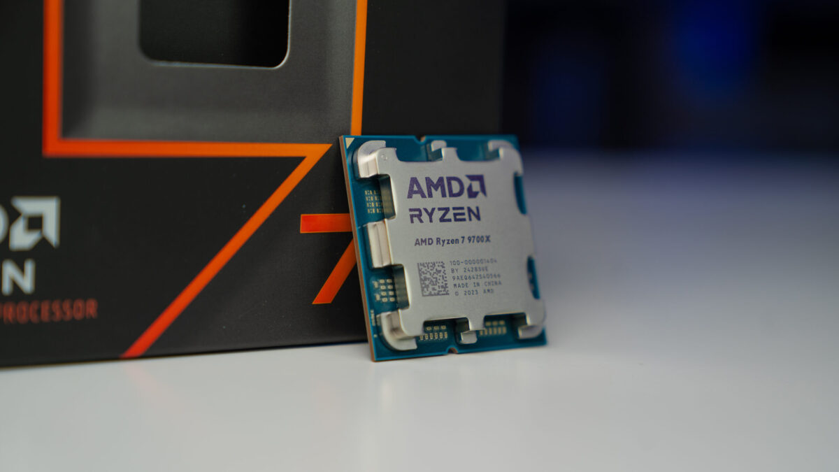 An AMD Ryzen 7 9700X CPU sat in front of its box